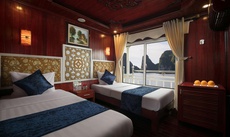 A bed or beds in a room at Rosa Boutique Cruise