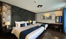 A bed or beds in a room at Arcady Premium Cruise